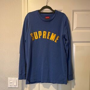 Supreme Navy Blue Long Sleeve Tee with Yellow Arch Logo.